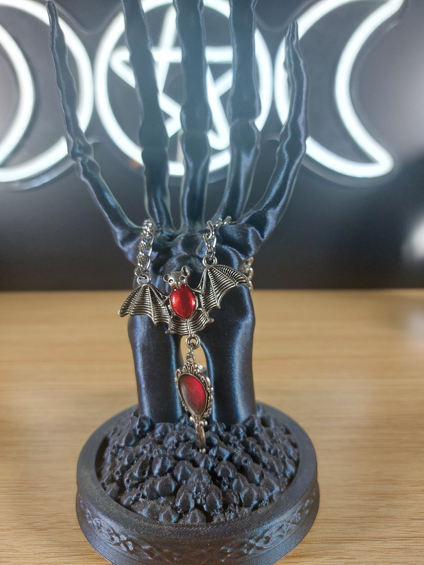 Silver Tone Bat Necklace with Red Stones