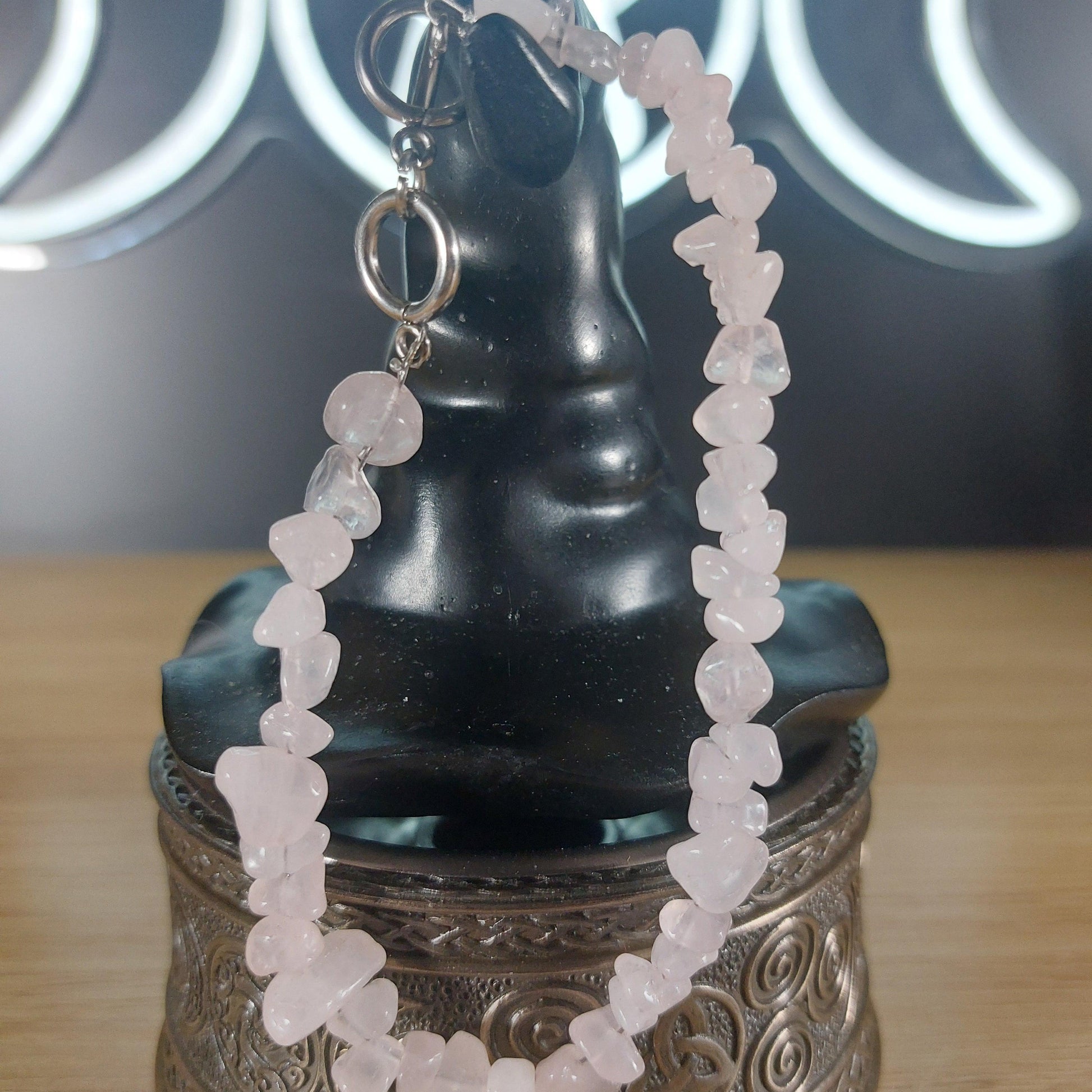 Pale pink rose quartz crystal chip bracelet with a silver stainless steel toggle clasp.