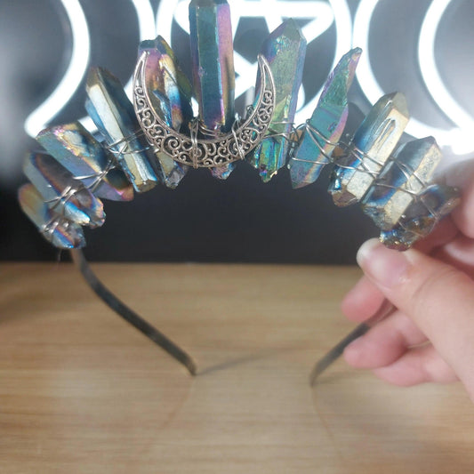 Metallic rainbow quartz crystal crown headband with a silver crescent moon accent.
