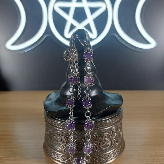 Amethyst crystal beaded bracelet with stainless steel findings, bead caps, and a pentagram charm.